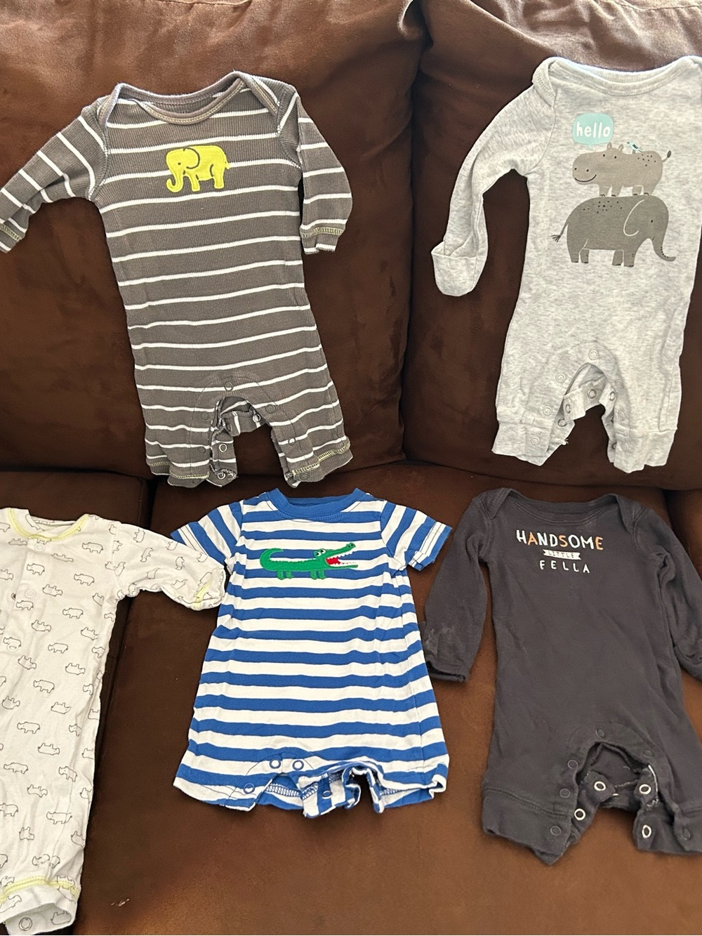 5 newborn size Carter’s one pieces: fair condition